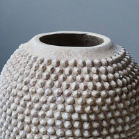Closeup of studded textured pot