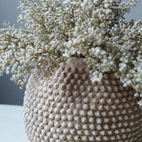 Closeup of beautiful round vase with lots of texture