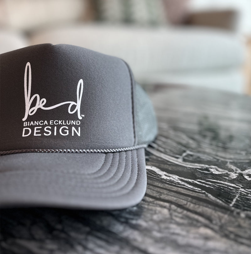 dark grey baseball hat with bed logo
