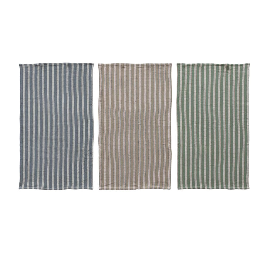 Three striped towels in different colors blue, green and natural on a white background