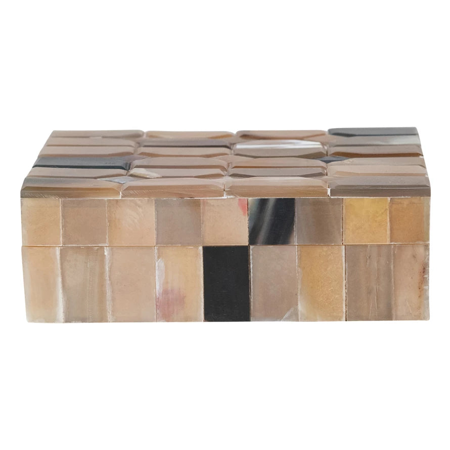 Decorative box with mosaic pattern on a white background