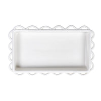 Rectangular white tray with scalloped edge on a white background