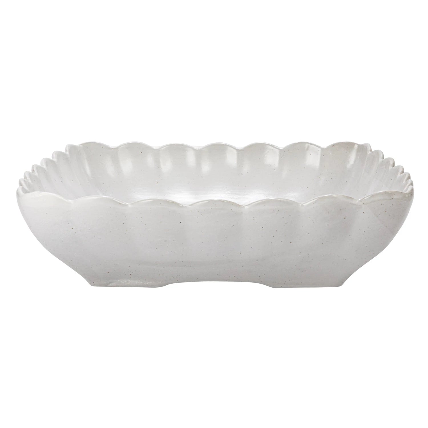 White ceramic bowl with scalloped edge on a white background