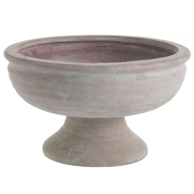 A rustic, beige ceramic urn with a wide bowl and short pedestal base. The surface is textured, giving a weathered, antique appearance.