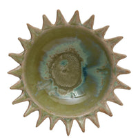 Ceramic bowl with sunburst design on a white background