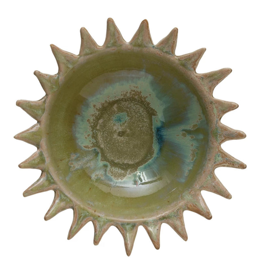 Ceramic bowl with sunburst design on a white background