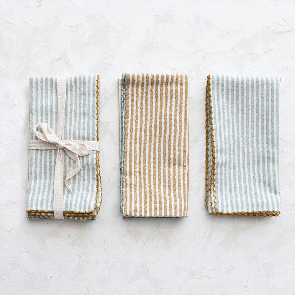 Three striped napkins on a light surface