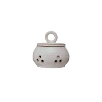 White ceramic incense burner with a handle on a white background