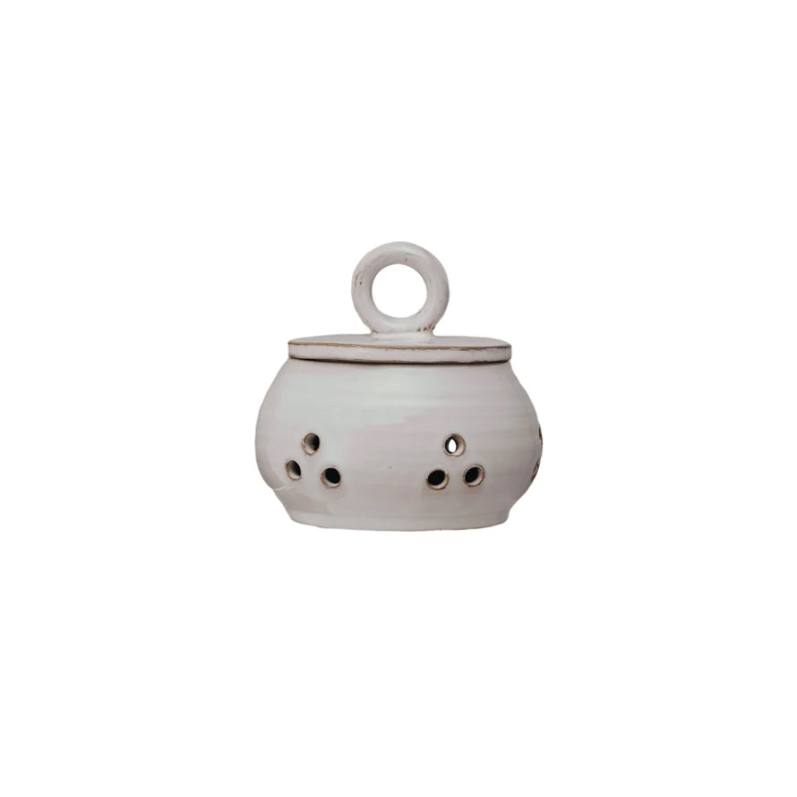 White ceramic incense burner with a handle on a white background