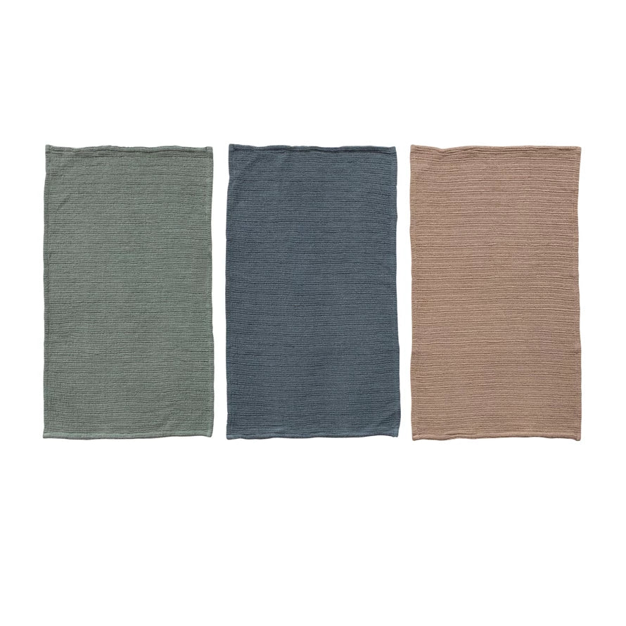 Three rectangular fabric samples in green, blue, and brown on a white background