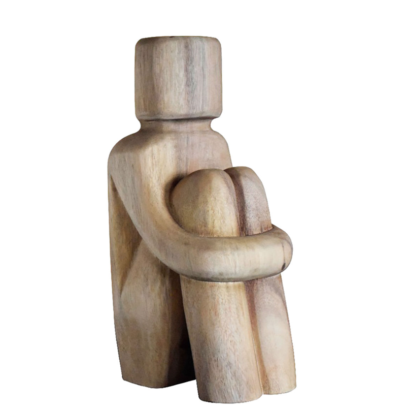 Charming abstract carved wooden sculpture of a person holding they knees 