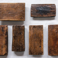 Set of six rustic wooden blocks on a white background